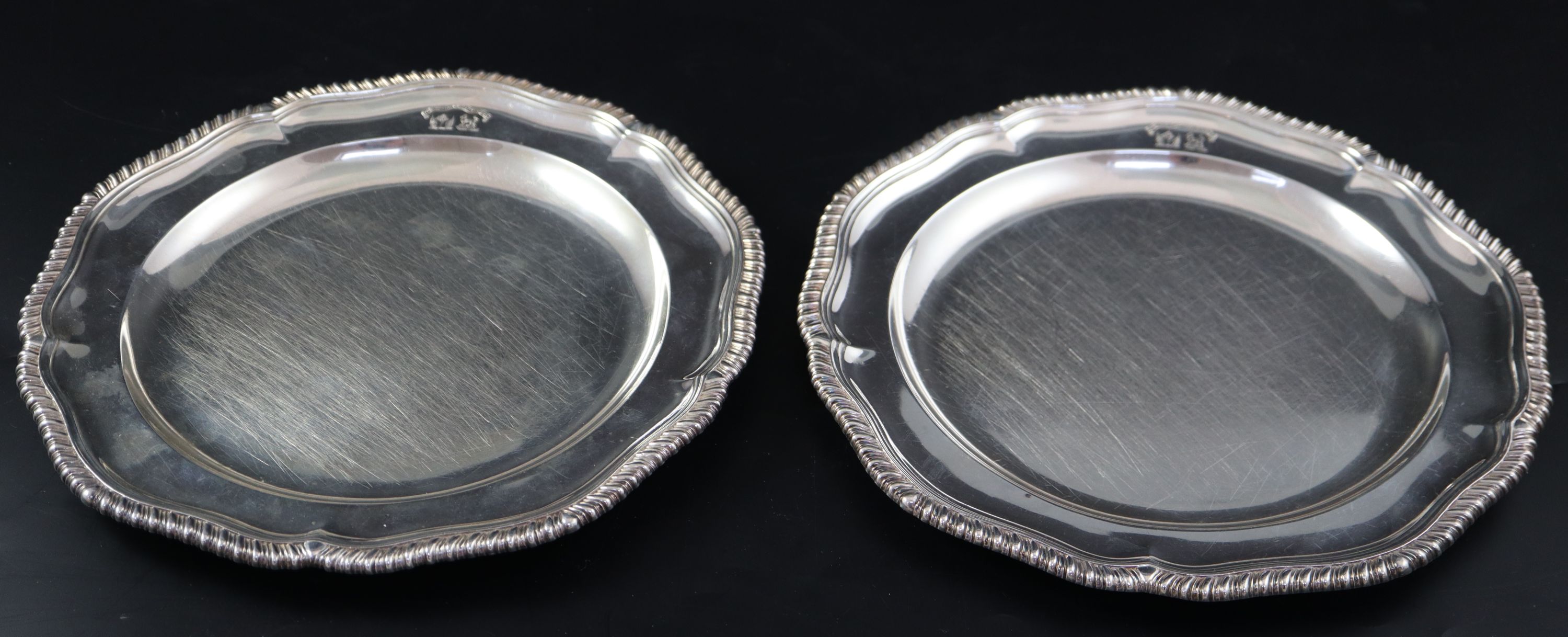 A pair of William IV silver dinner plates, by Robert Garrard, London, 1833, 25cm, 39oz
